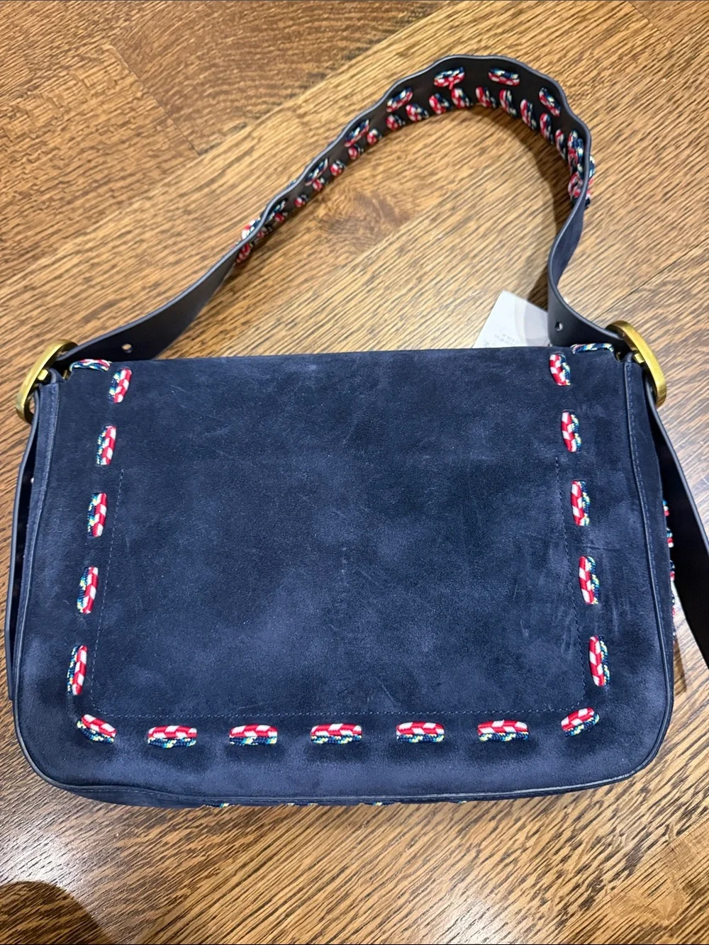 Tory Burch Navy Suede Shoulder Bag with Red-White Trim and Gold Buckle.